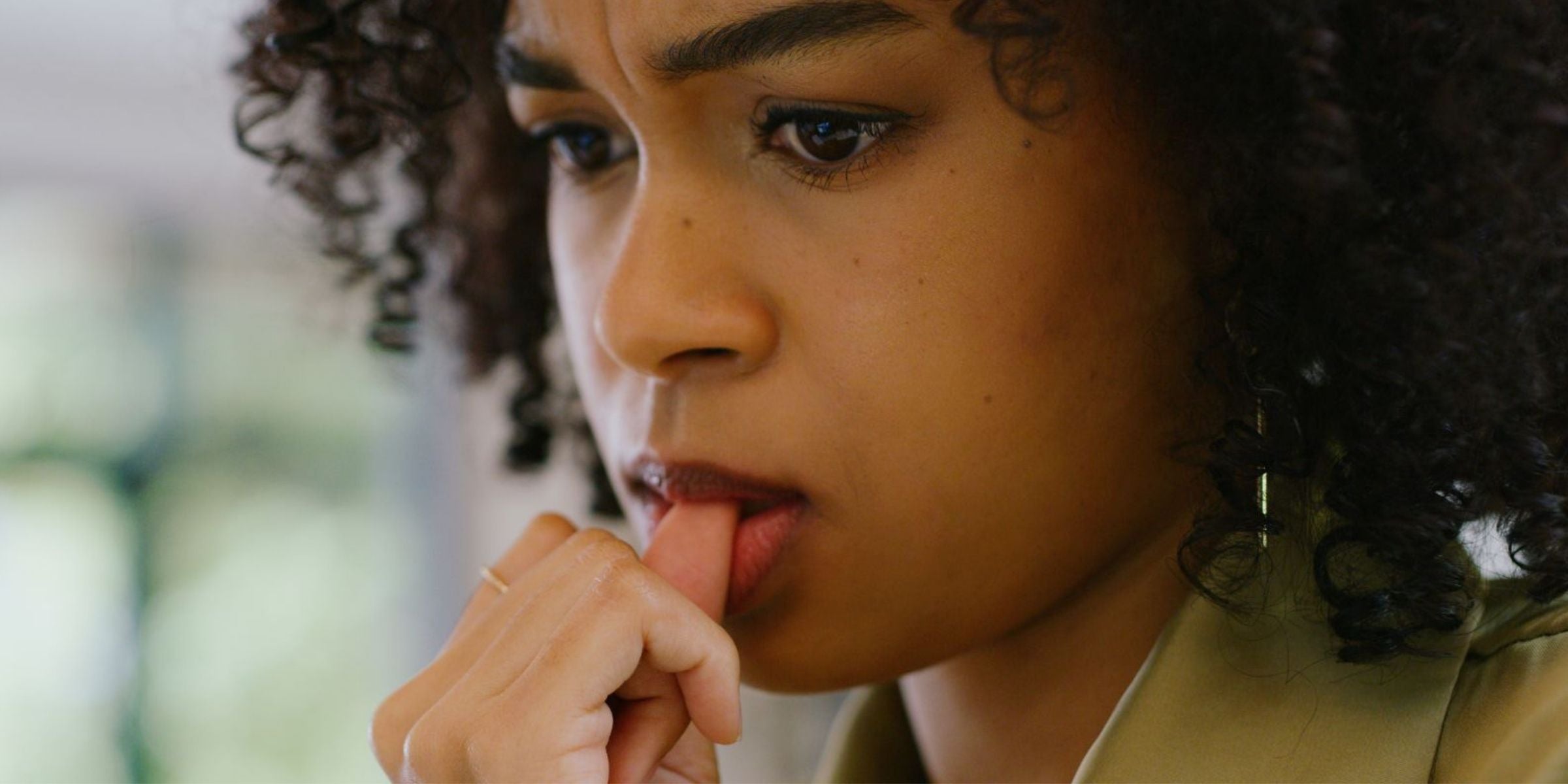 woman biting her nails anxiously