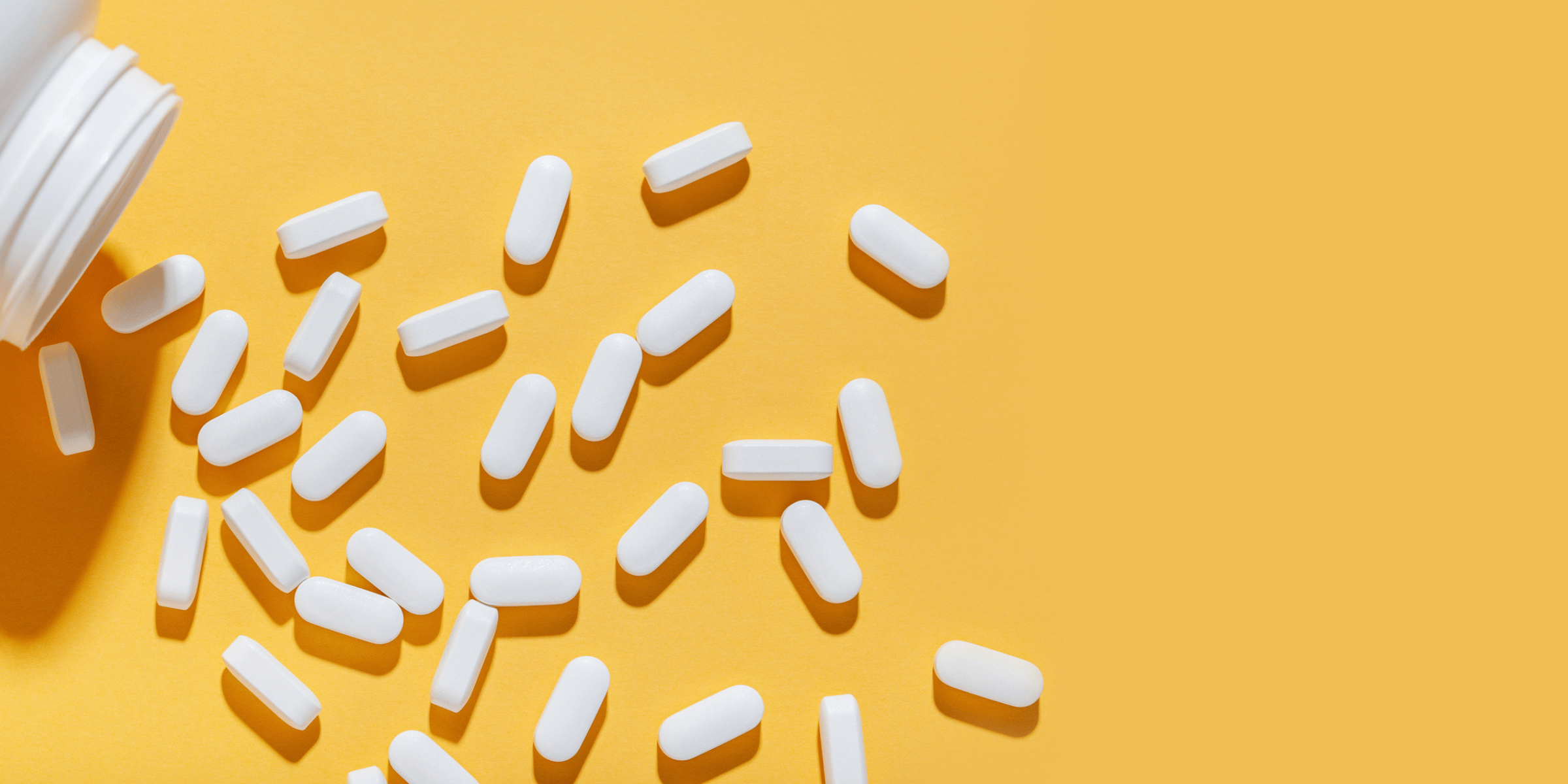 Tablets scattered across a yellow table.