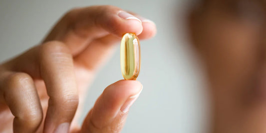 a transparent, yellowish capsule, likely a supplement