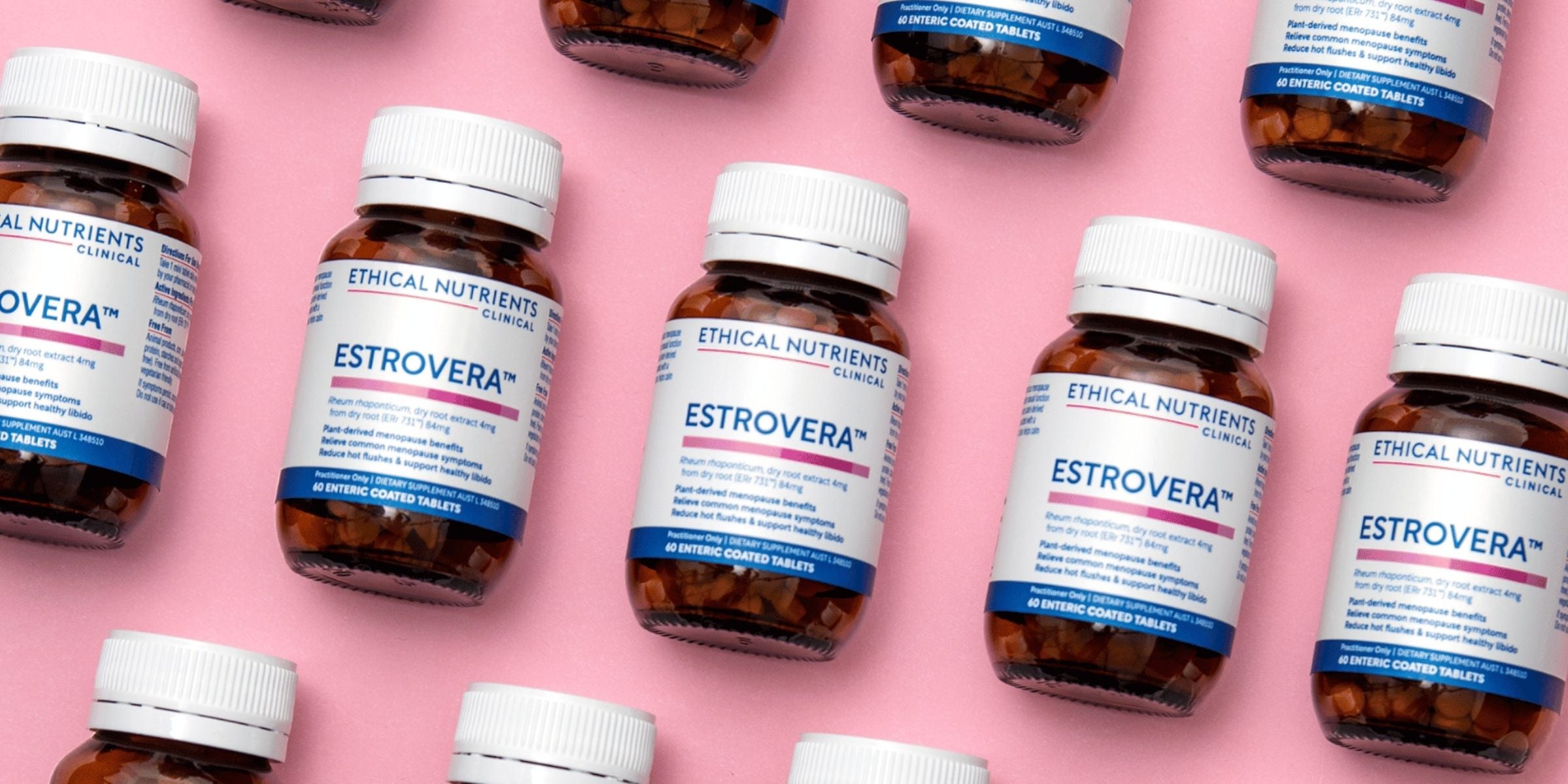 ethical nutrients clinical estrovera bottles lying side by side on a pink table