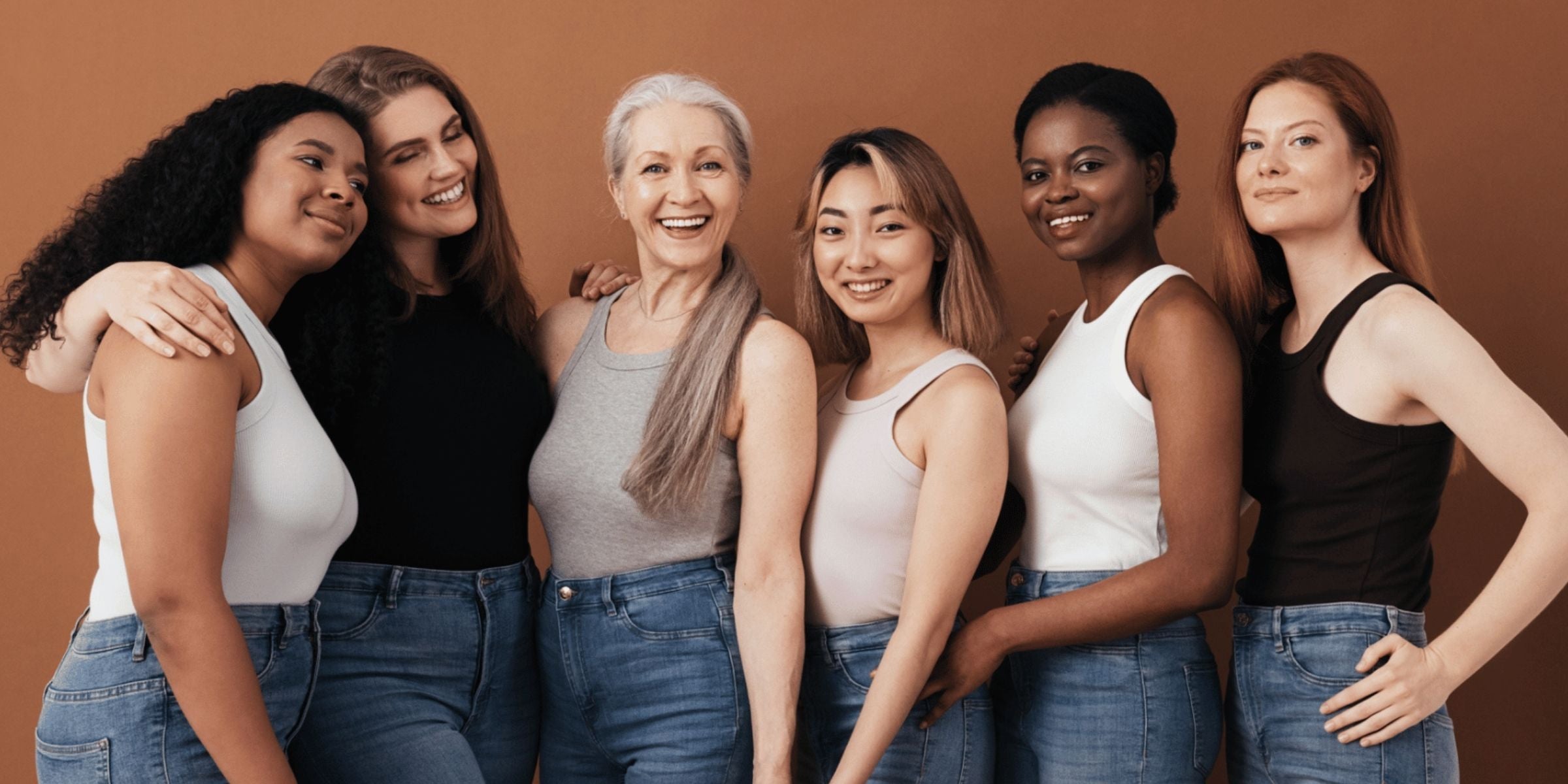a group of diverse women posing for a group photo