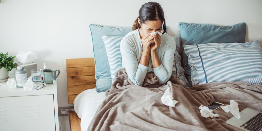 a woman suffering from a cold in bed