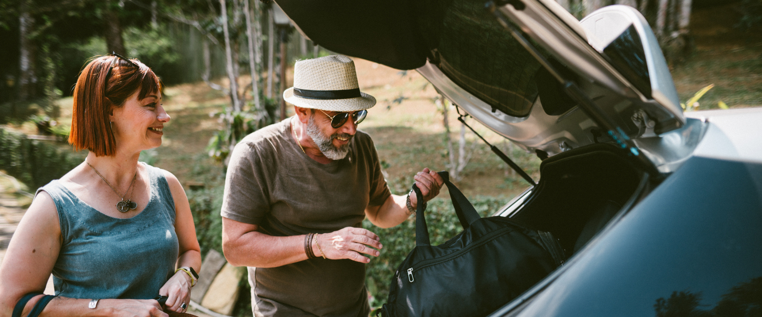 50 Year Old Couple Packing Car for Holiday